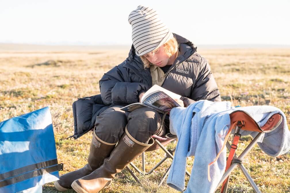 Reading a book in the Arctic