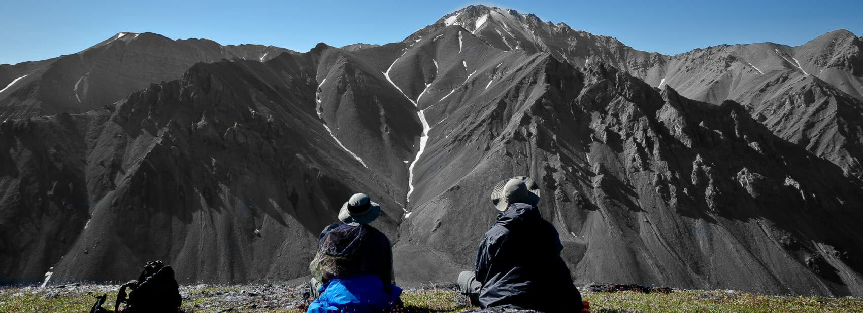 hikers enjoy a rest in the brooks range of Alaska
