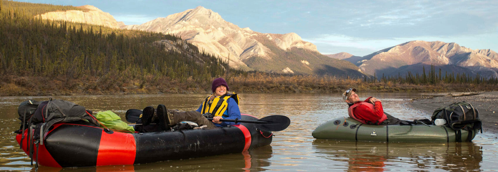2 packrafters relax in the Brooks Range